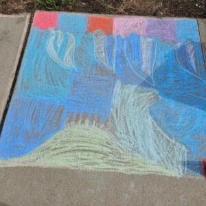 A Blue Tone Drawing in Chalk of a Child on the Pavement