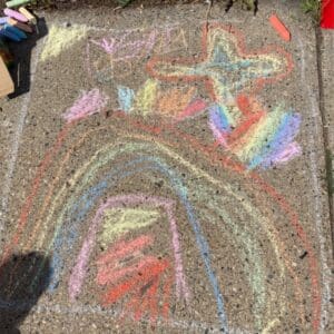 A Child Line Drawing on the Sidewalk Pavement