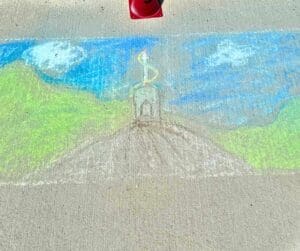 Chalk drawing of a castle on a hill.