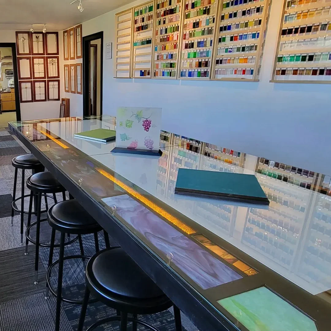 Cropped-Studio-with-office-view Glass studio with colorful glass samples.
